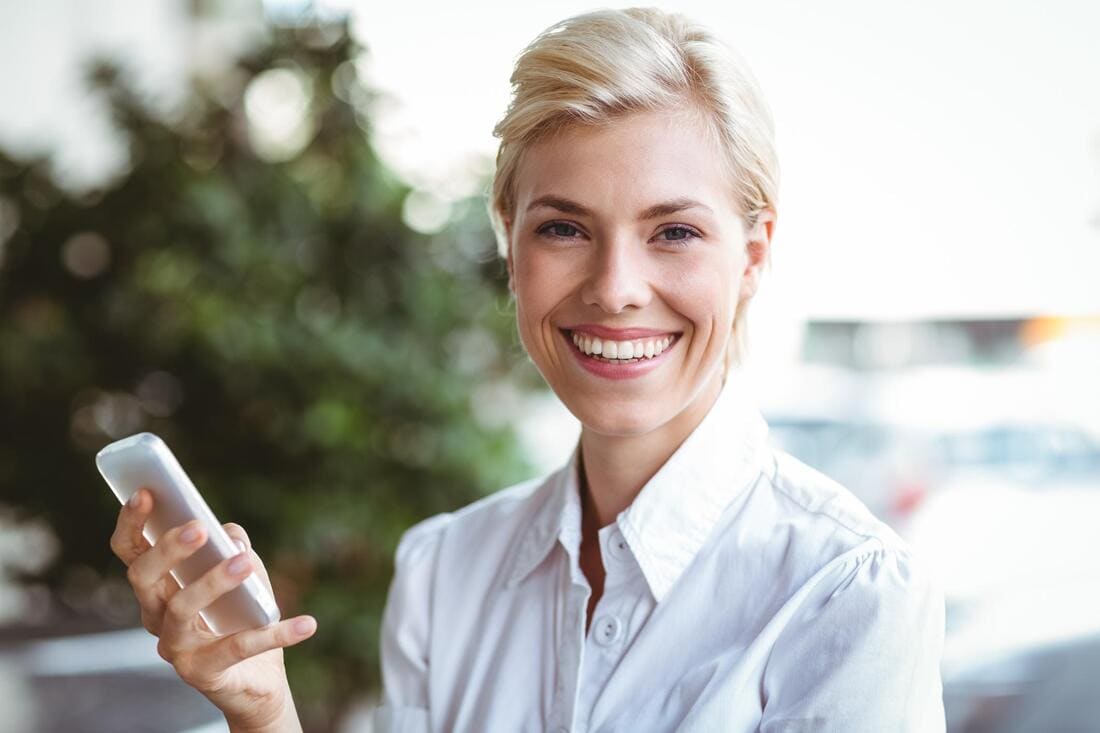 Woman speaking on a phone in an office